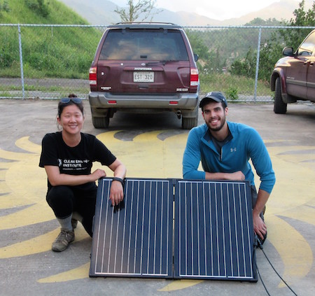 Lauren Kang and Wes Tatum with a recently-installed solar panel.