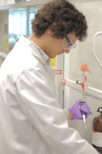 2013-2014 CEI Graduate Fellow Andrew Collard spreads solar ink on a glass substrate. His research with faculty member Hugh Hillhouse contributed to a $1.5 million grant from the Department of Energy SunShot initiative dedicated to reducing the cost and increasing the efficiency of solar energy to levels where it competes with current day fossil fuels in the energy markets.