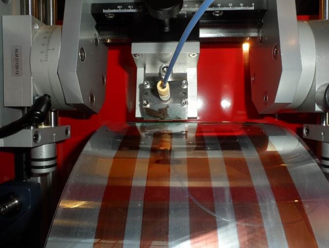 A machine using specialized inks to prink a thin-film solar cell. These materials may one day be used to achieve 31% cell efficiency. A machine using specialized inks to prink a thin-film solar cell. These materials may one day be used to achieve 31% cell efficiency.