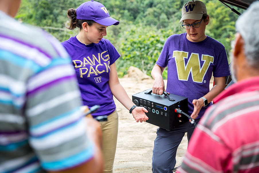 Pozzo (right) and electrical engineering Ph.D. student Mareldi Ahumada holding a battery