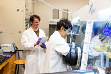 Connor Dalton (left) and Austin Wang (right) work together in the Reed Lab.